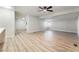 Bright living room with laminate flooring and ceiling fan at 3490 Allegheny Dr, Las Vegas, NV 89122