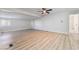 Large living room with laminate flooring and ceiling fan at 3490 Allegheny Dr, Las Vegas, NV 89122