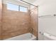 Clean bathroom with shower/tub combo and tile surround at 3837 Willowview Ct, Las Vegas, NV 89147