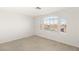 Bright bedroom featuring large window and tile floors at 3837 Willowview Ct, Las Vegas, NV 89147