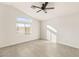 Bright bedroom with tile floors and ceiling fan at 3837 Willowview Ct, Las Vegas, NV 89147