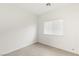 Simple bedroom with neutral walls and tile floors at 3837 Willowview Ct, Las Vegas, NV 89147