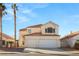 Two-story house with three-car garage and palm trees at 3837 Willowview Ct, Las Vegas, NV 89147