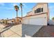 Two-story house with three-car garage and palm trees at 3837 Willowview Ct, Las Vegas, NV 89147