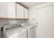 Laundry room with washer, dryer, and upper cabinets at 3837 Willowview Ct, Las Vegas, NV 89147