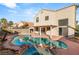 Inviting kidney shaped pool with a spa and patio at 3837 Willowview Ct, Las Vegas, NV 89147