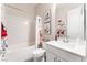 Bright bathroom with a shower-tub combo, modern vanity, and stylish decor at 421 Point Sur Ave, Las Vegas, NV 89138