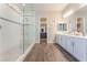 Primary bathroom with double vanity and large walk-in shower at 421 Point Sur Ave, Las Vegas, NV 89138