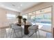 Dining room with sliding doors opening to a pool at 421 Point Sur Ave, Las Vegas, NV 89138