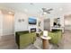 Living room with fireplace and green velvet sofas at 421 Point Sur Ave, Las Vegas, NV 89138