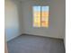 Spacious bedroom with carpeted floor and a window at 4763 Illustria Ave, Las Vegas, NV 89141