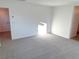 Spacious bedroom with carpeted floor and hallway access at 4763 Illustria Ave, Las Vegas, NV 89141