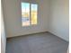 Bright bedroom with carpeted floor and window view at 4763 Illustria Ave, Las Vegas, NV 89141