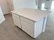 White kitchen island with quartz countertop and two drawers at 4763 Illustria Ave, Las Vegas, NV 89141