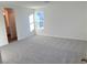 Large main bedroom with carpeted floor and adjacent bathroom at 4763 Illustria Ave, Las Vegas, NV 89141