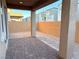 Covered patio and small backyard with block wall at 4771 Illustria Ave, Las Vegas, NV 89141