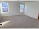 Spacious bedroom with two windows and neutral carpeting at 4771 Illustria Ave, Las Vegas, NV 89141