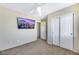 Bright bedroom with ceiling fan, large closet, and city view at 5064 Sacred Datura Ave, Las Vegas, NV 89139