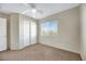 Bedroom with window, closet, and ceiling fan at 5064 Sacred Datura Ave, Las Vegas, NV 89139