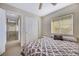 Bedroom with double closets and ceiling fan at 5064 Sacred Datura Ave, Las Vegas, NV 89139