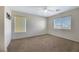 Spacious bedroom with two windows and ceiling fan at 5064 Sacred Datura Ave, Las Vegas, NV 89139