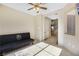 Common area with a futon and access to other rooms at 5064 Sacred Datura Ave, Las Vegas, NV 89139