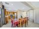 Dining area with a wooden table and access to the kitchen at 5064 Sacred Datura Ave, Las Vegas, NV 89139