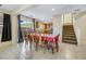 Bright dining room features a table with seating for four and a view into the kitchen at 5064 Sacred Datura Ave, Las Vegas, NV 89139