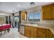 Kitchen with stainless steel appliances and wood cabinets at 5064 Sacred Datura Ave, Las Vegas, NV 89139