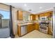 Kitchen with stainless steel appliances and wood cabinets at 5064 Sacred Datura Ave, Las Vegas, NV 89139