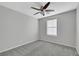 Cozy bedroom with ceiling fan and gray carpet at 5332 Iron Crossing Ave, Las Vegas, NV 89131