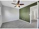 Spacious bedroom with accent wall and ceiling fan at 5332 Iron Crossing Ave, Las Vegas, NV 89131