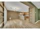 Open concept dining area with kitchen views and hardwood floors at 5332 Iron Crossing Ave, Las Vegas, NV 89131