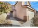 Two-story house with beige exterior and a grey front door at 5332 Iron Crossing Ave, Las Vegas, NV 89131