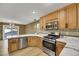 Modern kitchen with marble countertops and stainless steel appliances at 5332 Iron Crossing Ave, Las Vegas, NV 89131