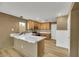 U-shaped kitchen with marble countertops and light wood cabinets at 5332 Iron Crossing Ave, Las Vegas, NV 89131