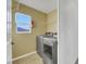 Laundry room with washer, dryer, and shelving at 5332 Iron Crossing Ave, Las Vegas, NV 89131