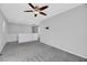 Spacious loft area with ceiling fan and neutral carpeting at 5332 Iron Crossing Ave, Las Vegas, NV 89131