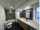 Modern bathroom with double vanity, soaking tub, and stylish wood-look wall accents at 8637 Tivoli Ct, Las Vegas, NV 89117