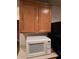 White microwave and light wood cabinets at 10265 Franford Ct, Las Vegas, NV 89183