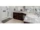 Bathroom with granite vanity, large shower, and tile floor at 10440 Irish Cliffs Ct, Las Vegas, NV 89149
