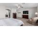 Main bedroom with a large TV and walk-in closet at 10440 Irish Cliffs Ct, Las Vegas, NV 89149
