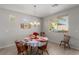 Bright dining room with a table and chairs, adjacent to the kitchen at 10440 Irish Cliffs Ct, Las Vegas, NV 89149
