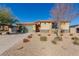 Single-story house with a stone facade and landscaped front yard at 10440 Irish Cliffs Ct, Las Vegas, NV 89149