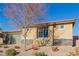 Single-story house with a stone facade and landscaped front yard at 10440 Irish Cliffs Ct, Las Vegas, NV 89149