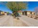 Single-story house with double driveway and a landscaped front yard at 10440 Irish Cliffs Ct, Las Vegas, NV 89149