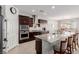 Island kitchen features granite countertops and stainless steel appliances at 10440 Irish Cliffs Ct, Las Vegas, NV 89149