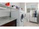 Bright laundry room, washer, dryer, and ample storage at 10440 Irish Cliffs Ct, Las Vegas, NV 89149
