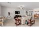 Living room with tile floors, neutral walls, and a large TV at 10440 Irish Cliffs Ct, Las Vegas, NV 89149