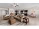Open living room features a cozy seating area and flows into the kitchen at 10440 Irish Cliffs Ct, Las Vegas, NV 89149